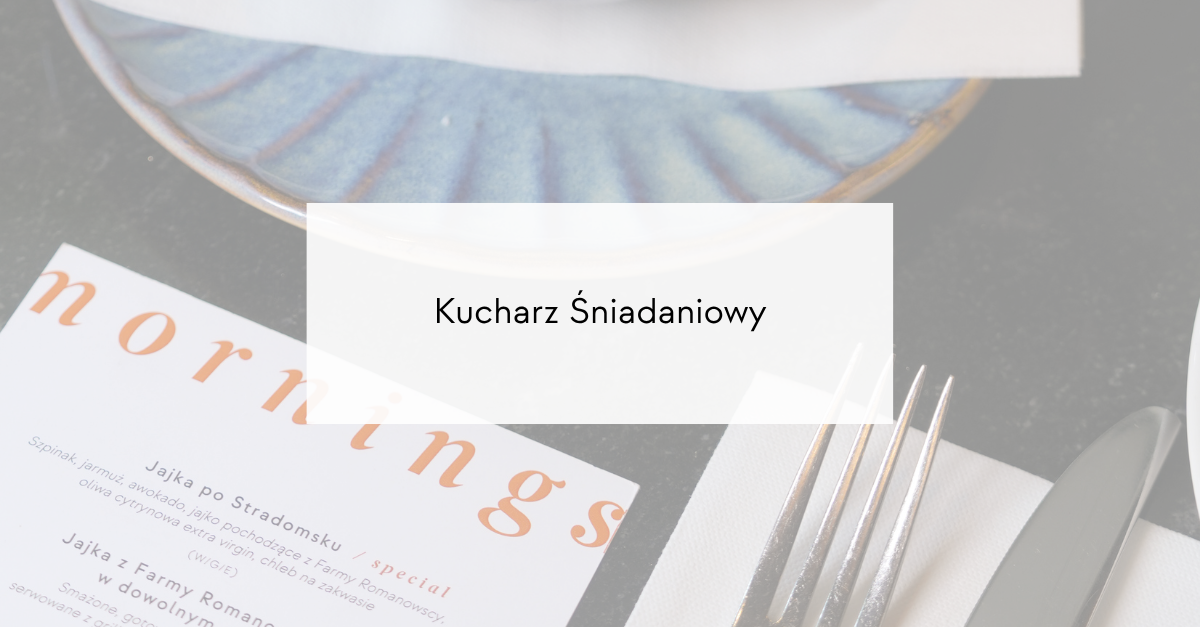 Breakfast-setting image with a menu and cutlery on a dark table; overlaid text reads 'Kucharz Śniadaniowy' as the page title.